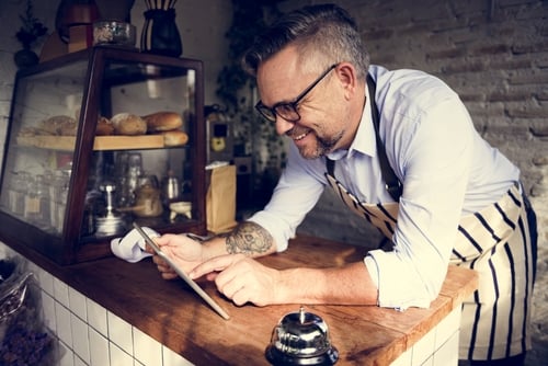 small business owner looking at an ipad
