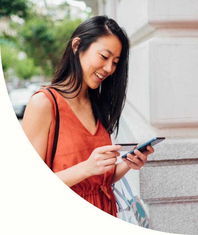 Young woman about to use the ATM machine
