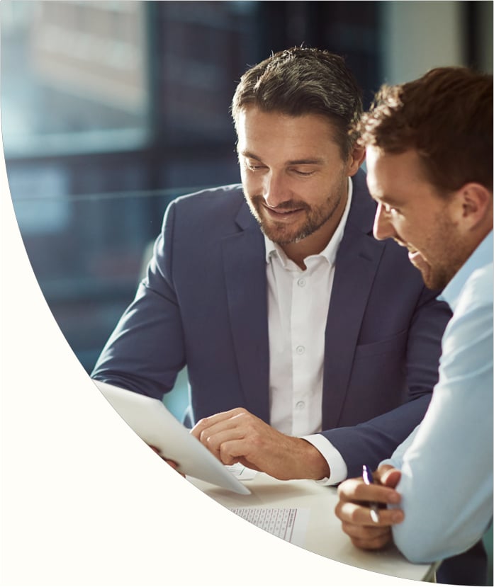 Man reviewing paperwork with advisor
