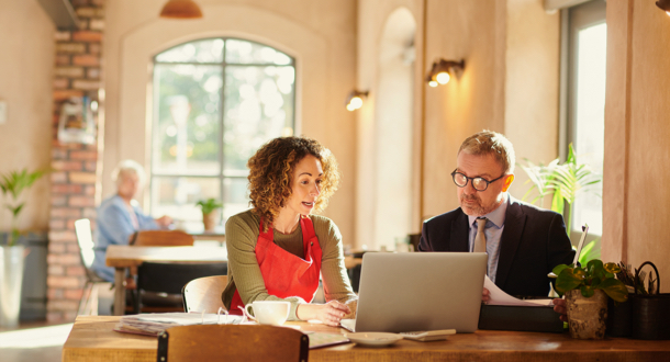 cafe owner meeting with lending advisor for commercial lending