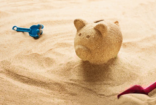 Biggy bank in the sand