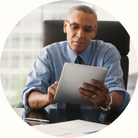 male business professional working on tablet