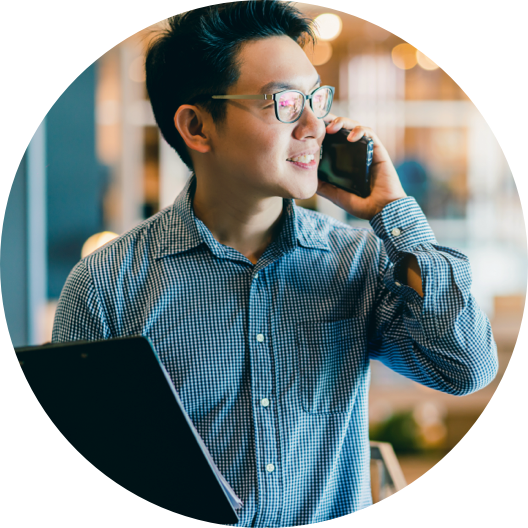 asian business owner using smartphone woking in office
